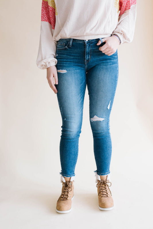 Mid Rise Distressed Hem Skinny Jean